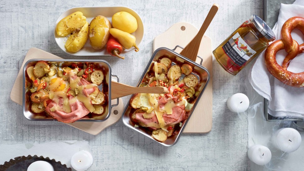 Raclette mit Brezeln, Ei und Leberkäse