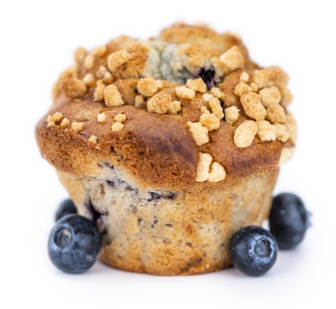 Blueberry Muffins isolated on white background (selective focus; close-up shot)