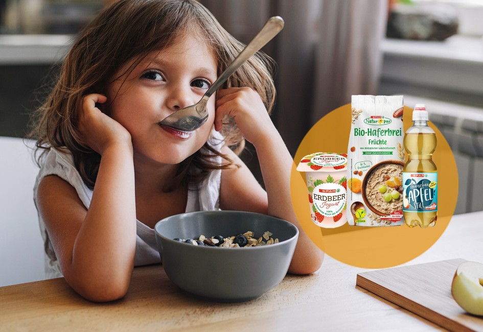 Mädchen beim Frühstück mit zuckerreduzierten Produkten von SPAR