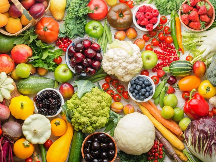 Healthy summer fruits vegetables berries background, cherries peaches strawberries cabbage broccoli cauliflower squash tomatoes carrots spring onions beans beetroot, pepper, top view, selective focus